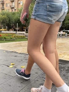 Candid teen wearing denim shorts passing by, nice legs