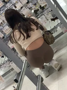 Cutie with round ass in beige leggings at the mall