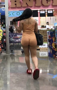 Latina with hard nipples and a big booty in tight spandex shorts outfit