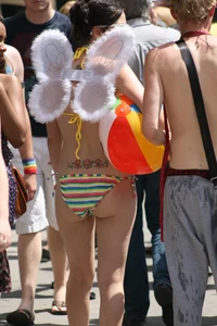 Nude small boobed girl at Toronto pride parade with a couple bonus girls