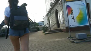 Girl walking in denim shorts showing some of her ass cheeks
