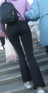 Juicy ass in black tight jeans and nice skinny legs street closeups