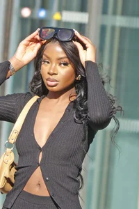 Slim ebony teens in leggings posing in the sun
