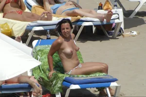 Girls on a nude beach in Sitges, Spain