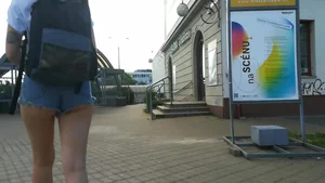 Girl walking in denim shorts showing some of her ass cheeks
