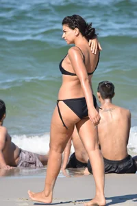 Thick mature brunette bikini lady on the beach with a nice body