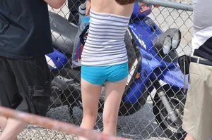 Skinny babe with a cute little ass in tiny blue shorts