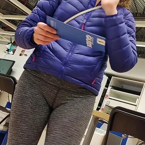 Blonde lady shopping in tight dark grey leggings