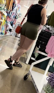 Juicy brunette in green spandex shorts OC