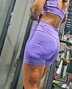 Girl in lilac short leggings at the gym