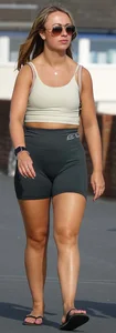 Blonde woman in lycra shorts - good front view, back view ruined by a bag