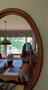 Slim Candid Girl in Shorts and a Bra Mirror Selfie