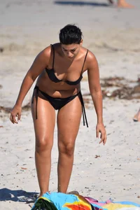 Thick mature brunette bikini lady on the beach with a nice body