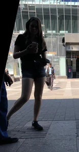 Cute Girl Distributing Leaflets in Shorts City Candid Gallery