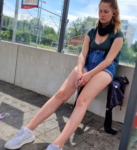 A Cute Candid Girl With Long Gorgeous Legs in Jean Shorts Sitting at the Bus Stop Creepshots