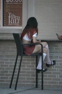 Two sexy Tilted Kilt employees showing cleavage and cheeks