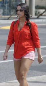 Babe in pink shorts walking showing a bit of cleavage and almost a nip slip