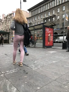 Cute skinny blonde candid teen wearing tight pink jeans