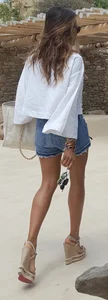 Flat ass leggy girl in denim shorts