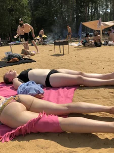 Hot Girls in Swimsuits Lying on a Beach Gallery