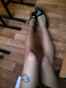 Teen in Flats and Pantyhose Sitting on the Classroom Floor College Selfie