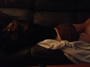 Girl in Shorts Asleep on the Couch Home Creepshot