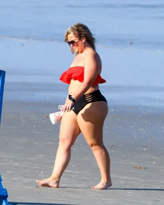 Thick BBW blonde lady in a bikini at the beach
