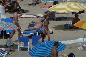 Girls on a nude beach in Sitges, Spain