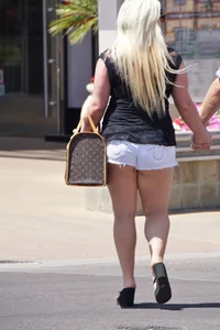 Thick blonde with big boobs in short white shorts