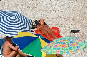 Ula FKK Sexy brunette on a nude beach topless, bottomless and with blue thong