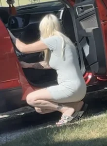 Blonde milf cleaning out her car VTL