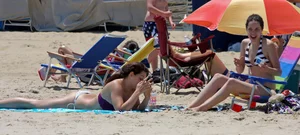 Two beach friends looking sexy in bikinis
