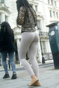 Brunette lady with a nice ass in light grey leggings walking
