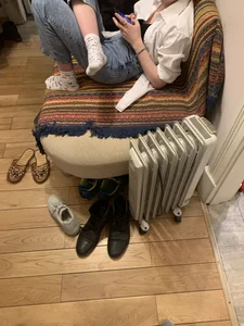 Young Skinny Girl in Jeans and White Socks Lying on the Couch With Crossed Legs Home Creepshot