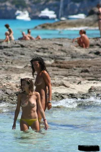 Nude beach ladies in the water showing their tits