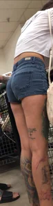 Slim tatted succubus in cheeky jean shorts