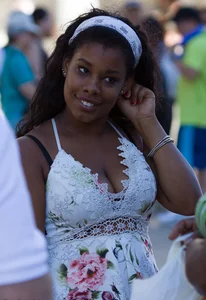 Black girl showing major cleavage in dress and almost upskirted
