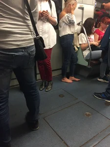 Barefoot subway blonde girl in a train creepshots