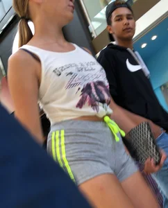 Blonde in little grey shorts with vpl showing her ass cheeks and slight camel toe