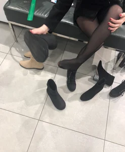 Candid teen wearing black pantyhose changing shoes creepshots