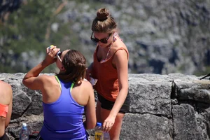 Tourist friends backpacking in shorts with vpl