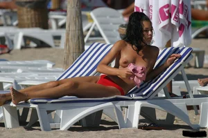 Beach voyeur girls in bikinis, thongs and topless