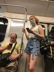 Girl in Blue Denim Shorts and Flats Standing in Subway Train - Nice Legs Closeup