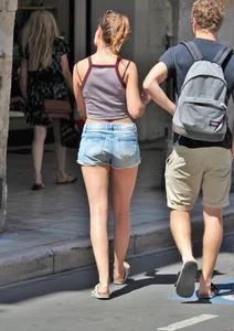 Beautiful teen out with boyfriend in short jean shorts