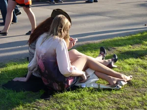 Girls Sitting on the Lawn in Skirts City Candid