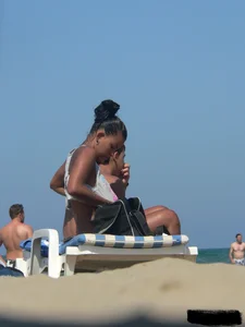 Hot ass topless beach girl with great tits lets her little brother oil up her ass in thong bikini