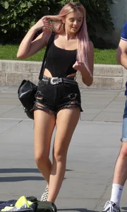 Tall blonde and pink haired girl showing her ass cheeks