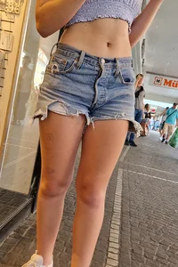 Adorable cute candid teen wearing a top and fringe jean shorts street creepshots, nice tummy and legs