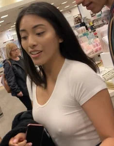 Pretty babe in tight jeans showing nipples in book store w bf (Not OC)(Face shot)