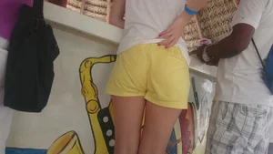 Milf in yellow shorts with vpl and a wedgie